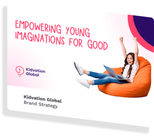 Kid celebrating with laptop on orange bean bag