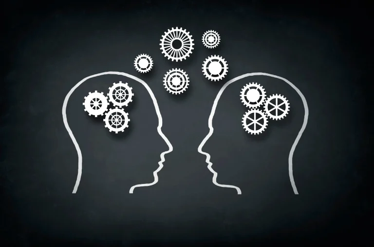 Silhouettes with gears illustrating communication.