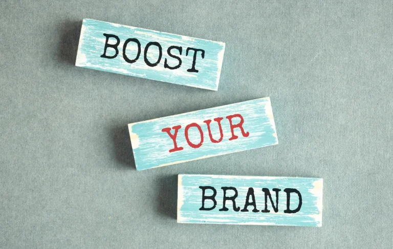 boost your brand - word abstract in vintage letterpress wood type stained by color inks